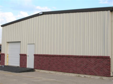 metal building sheeting|metal building with brick front.